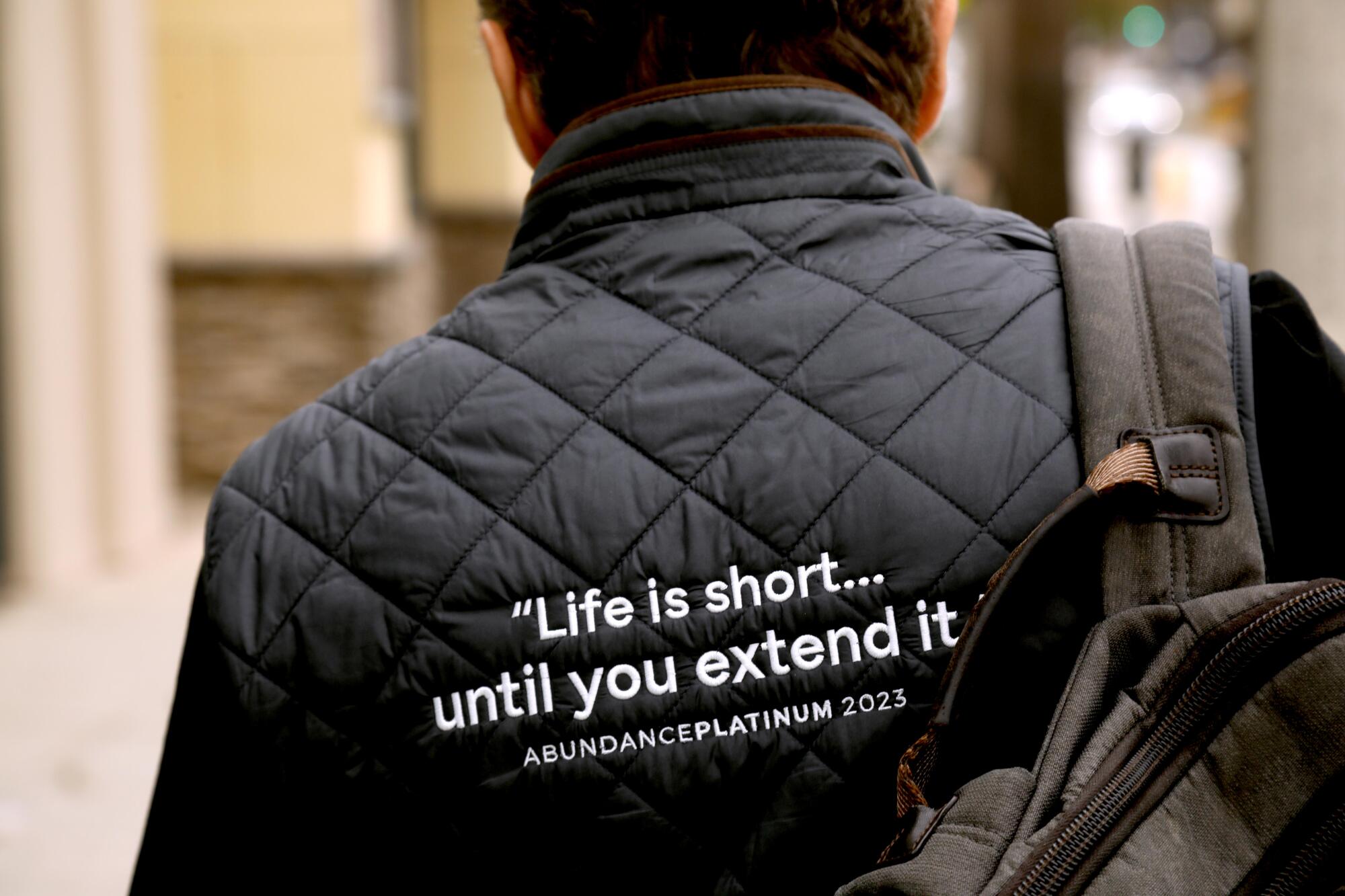 "Life is short until you extend it," is written on Dr. Peter Diamandis' vest as he walks to his doctor's office.