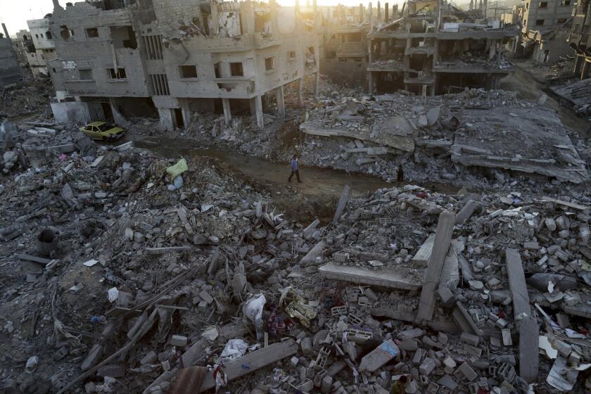 Homes lie in ruin after Israeli strikes in the town of Beit Hanoun, in the northern Gaza Strip.