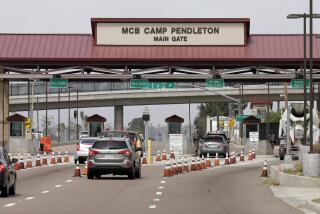 The entrance to Marine Corps base Camp Pendleton is seen Tuesday, Sept. 22, 2015, in Oceanside, Calif. (AP Photo/Gregory Bull)