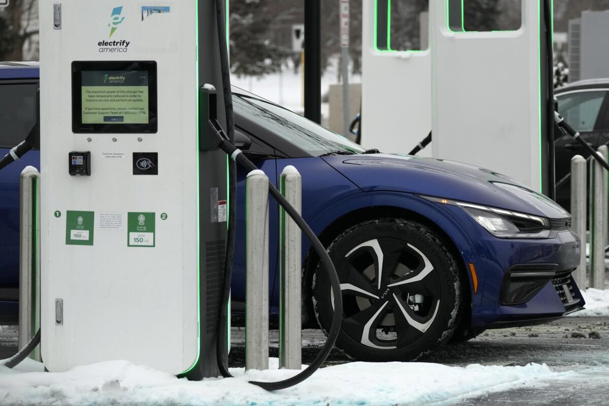 An electric vehicle charges at an EVgo fast charging station.