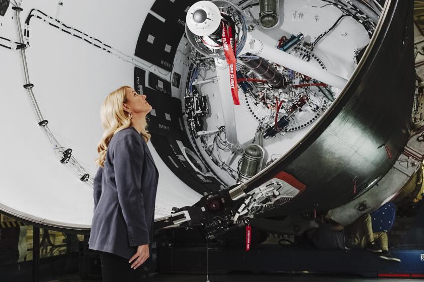 Gwynne Shotwell looks over the manufacturing of a rocket at a Space-X manufacturing facility in Los Angeles, California
