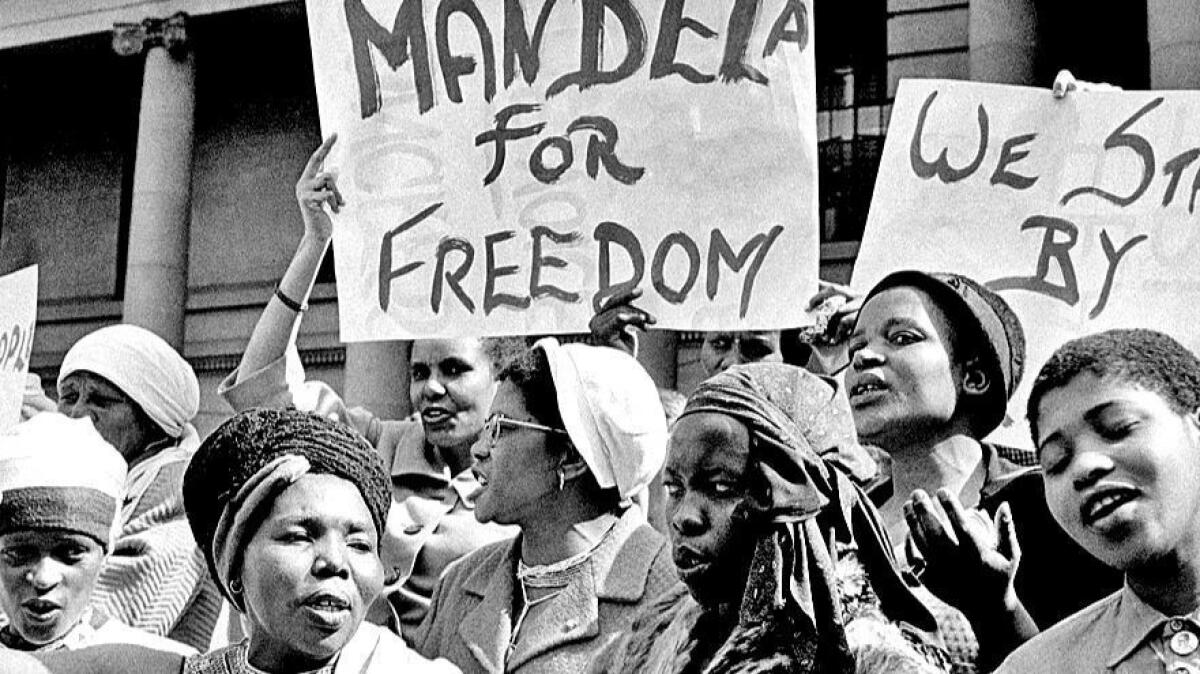 Protesters demonstrate on August 16, 1962, demanding Mandela's release after his second arrest. His wife Winnie, whom he had married in 1958, joined the protests. Mandela was sent to a penal colony off Cape Town, where he spent 13 years laboring in a quarry.