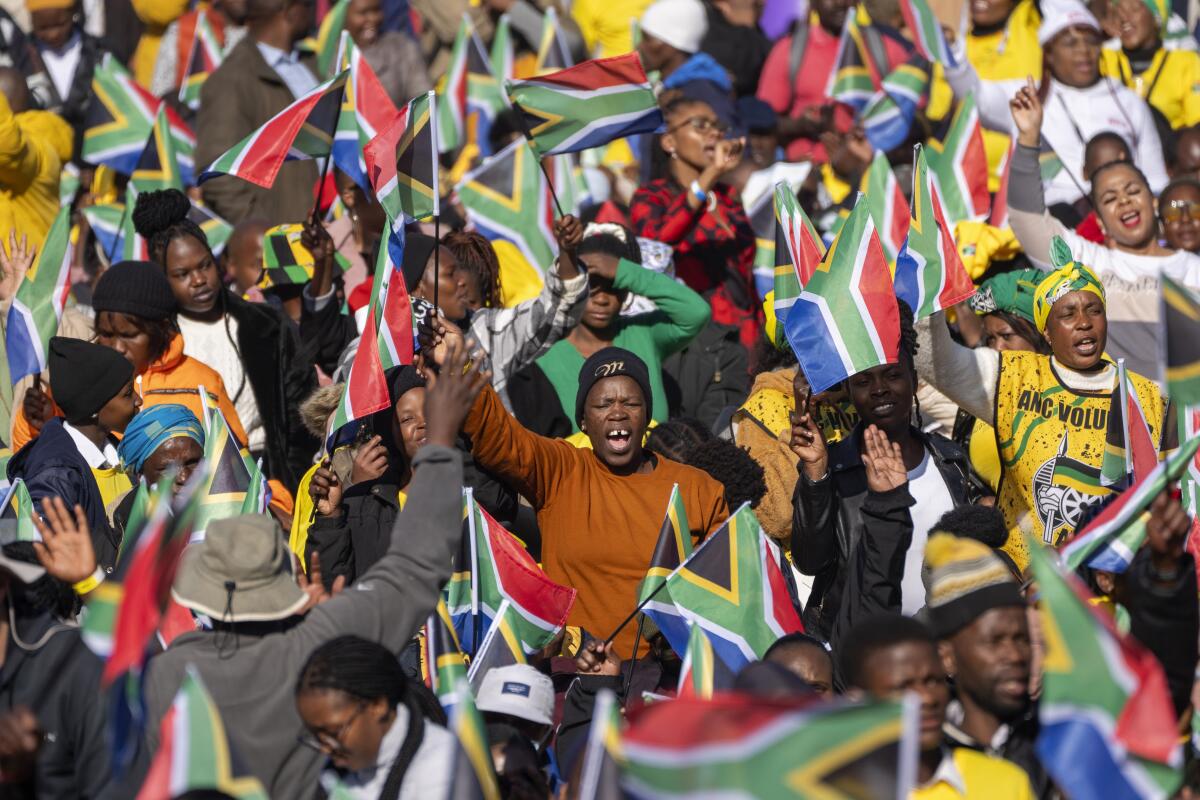 South Africans gather ahead of the inauguration of South Africa's Cyril Ramaphosa as president in Pretoria.