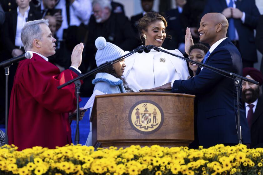 Wes Moore is sworn in as the 63rd governor of the state of Maryland by Maryland Supreme Court Chief Justice Matthew Fader, Wednesday, Jan. 18, 2023, in Annapolis, Md. (AP Photo/Julia Nikhinson)