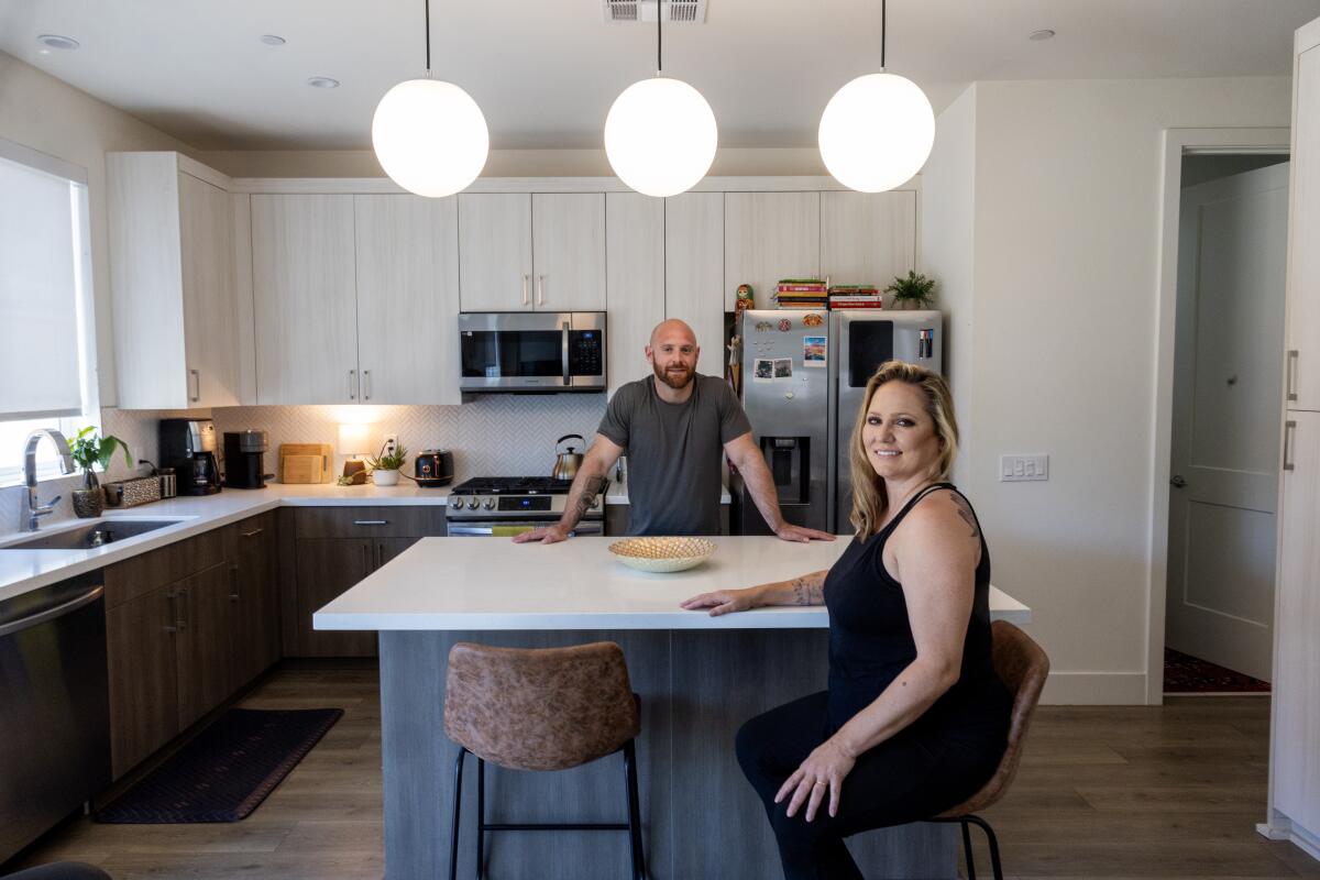 Spencer and Chelsey Marks in their kitchen 