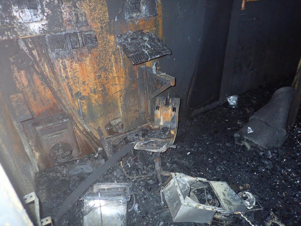 Debris inside a charred trailer