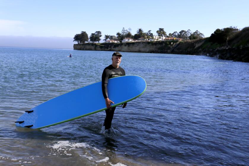 CALIFORNIA, CA -- THURSDAY, JULY 28, 2016: Los Angeles Times columnist Steve Lopez finally realizes his childhood dream to surf in Santa Cruz. Lopez is on a California coastal tour marking the 40th anniversary of the Coastal Act. Photo taken in Santa Cruz, CA, July 28, 2016. (Allen J. Schaben / Los Angeles Times)