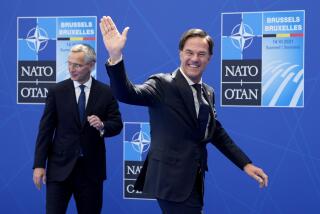 FILE- NATO Secretary General Jens Stoltenberg, left, greets Dutch Prime Minister Mark Rutte during arrivals for a NATO summit at NATO headquarters in Brussels, Monday, June 14, 2021. Over the course of more than a dozen years at the top of Dutch politics, Mark Rutte got to know a thing or two about finding consensus among fractious coalition partners. Now he's going to bring the experience of leading four Dutch multiparty governments to the international stage as NATO's new secretary general. (AP Photo/Francois Mori, Pool)