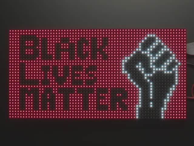 Vide of assembled and powered on 64x32 RGB LED Matrix Panel - 4mm pitch. The matrix displays "Black Lives Matter" alongside the Raised Fist.