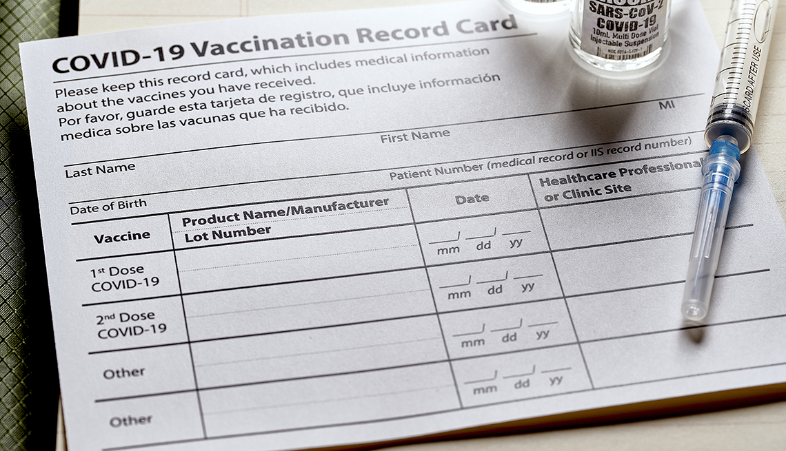 Covid-19 Vaccination card with syringe and vials