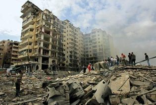 Beirut: rescue workers search the rubble of a bombed building