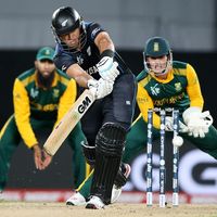 New Zealand's Ross Taylor plays a shot as South African wicketkeeper Quinton De Kock watches during their Cricket World Cup semifinal in Auckland, New Zealand, Tuesday, March 24, 2015. 2015 ICC Cricket World Cup, Sports, Men's cricket