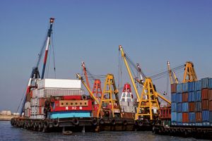 cranes unloading containers