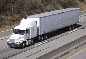 A “semi,” or semitrailer drawn by a truck tractor, on the highway, United States.