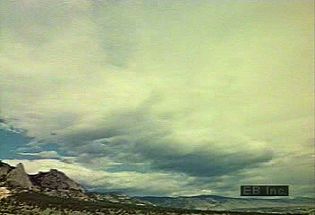 View a time-lapse video of cloud formations rolling across the sky followed by a thunderstorm