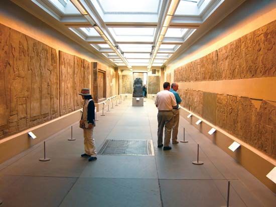 Carved stone panels from the Northwest Palace of Ashurnasirpal II at what is now Nimrūd, Iraq; in the British Museum, London.