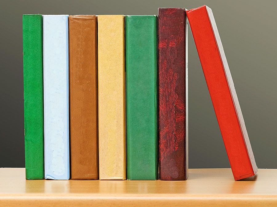 Row of colorful books on a bookshelf. Stack of books, pile of books, literature, reading. Homepage 2010, arts and entertainment, history and society