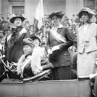 Prominent woman's suffrage advocates parade in an open car supporting the ratification of the 19th amendment granting women the right to vote in federal elections. (From left) W.L. Prendergast, W.L. Colt, Doris Stevens, and Alice Paul; c. 1910-15.