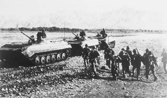 Soviet BMP-1 mechanized infantry combat vehicles moving through Afghanistan, 1988.