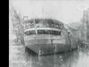 See recovery workers righting the capsized Eastland in the Chicago River, 1915