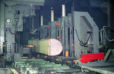 band saw breaking a log down into lumber