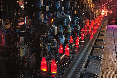 Figure 9: Newly formed bottles being transported by conveyor to the annealing lehr.