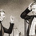 Michael Faraday (L) English physicist and chemist (electromagnetism) and John Frederic Daniell (R) British chemist and meteorologist who invented the Daniell cell.