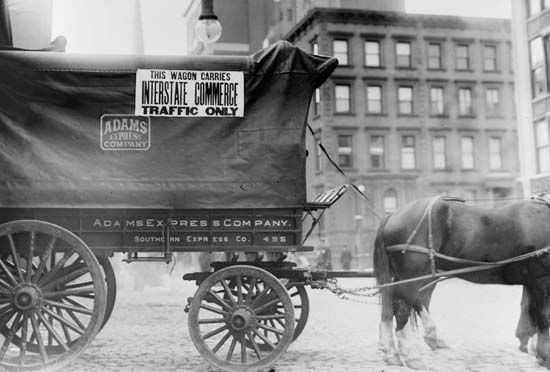 Sign displayed on horse and wagon, c. 1900, specifying that it was being used for “Interstate Commerce Traffic Only.”