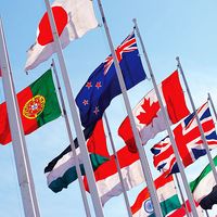 Flags of the world against blue sky. Countries, International. Globalization, global relations, Australia, Canada, United Kingdom, Poland, Palestine, Japan. Homepage 2010, arts and entertainment, history and society