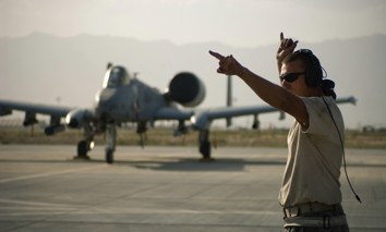 In this 2008 photo, a crew chief with the 455th Expeditionary Aircraft Maintenance Squadron directs an A-10 Thunderbolt II at Bagram Air Field, Afghanistan.