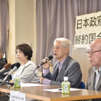 日本政府への抗議文を発表する「核兵器禁止条約の会・長崎」の共同代表たち＝長崎市で