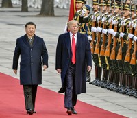 This file photo taken in November 2017 shows U.S. President Donald Trump alongside Chinese President Xi Jinping at a welcoming ceremony during his visit to Beijing. (Kyodo)