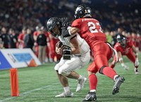 The Panasonic Impulse's Yuya Araki, left, scores a touchdown against the Fujitsu Frontiers during the second quarter of Japan's Rice Bowl American football championship at Tokyo Dome on Jan. 3, 2025. (Kyodo)