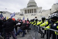 Insurrectionists loyal to President Donald Trump try to break through a police barrier, on Jan. 6, 2021, at the Capitol in Washington. (AP Photo/Julio Cortez, File)