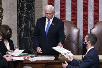 Vice President Mike Pence returns to the House chamber after midnight, Jan. 7, 2021, to finish the work of the Electoral College after a mob loyal to President Donald Trump stormed the Capitol in Washington and disrupted the process. (AP Photo/J. Scott Applewhite, File)