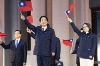 In this photo released by the Taiwan Presidential Office, Taiwan's President Lai Ching-te waves the Taiwanese flag during a flag raising ceremony in Taipei, Taiwan, on Jan. 1, 2025. (Taiwan Presidential Office via AP)