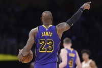 Los Angeles Lakers forward LeBron James gestures during the second half of an NBA basketball game against the Atlanta Hawks, Friday, Jan. 3, 2025, in Los Angeles. (AP Photo/Mark J. Terrill