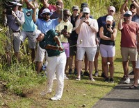 Hideki Matsuyama of Japan hits his second shot on the 17th hole during the third round of the PGA Tour's season-opening Sentry tournament at Kapalua Golf's Plantation Course in Hawaii on Jan. 4, 2025. (Kyodo)