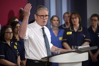 Britain's Prime Minister Keir Starmer gives a speech on reducing NHS wait times as he visits a healthcare provider in Surrey, England, on Jan. 6, 2025, (Leon Neal/Pool Photo via AP)