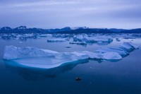 A boat navigates large icebergs near the town of Kulusuk, in eastern Greenland, on Aug. 15, 2019. (AP Photo/Felipe Dana, File)