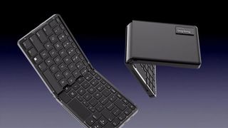 a black keyboard PC folded in half