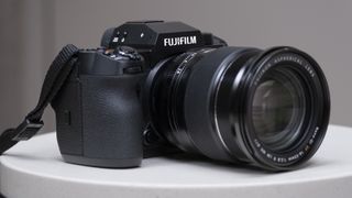 The Fujifilm X-H2 camera setting on a white table