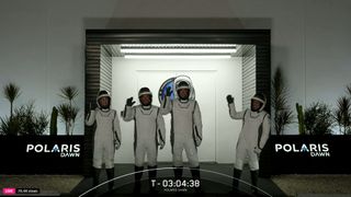 SpaceX's Polaris Dawn astronauts wave as they head to launch pad