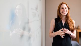 A person doing a presentation on a whiteboard.