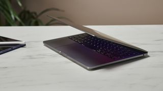 MacBook Pro 13-inch M2 model in an office on a desk