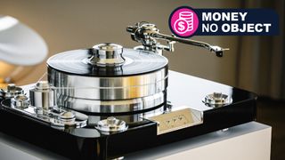 Pro-Ject Signature 12.2 Flagship turntable on a beige plint, with TR&#039;s &#039;Money no object&#039; franchise badge