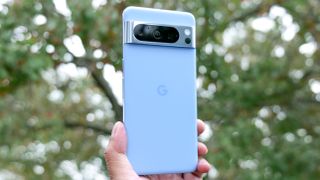 Google Pixel 8 Pro held in hand.