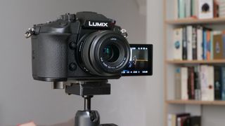 The Panasonic GH6 camera sitting on a tripod