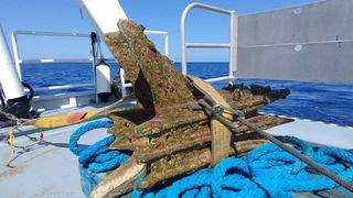 A bronze battering ram on the deck of a ship