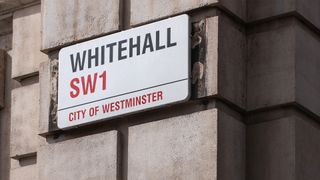 Sign for Whitehall SW1 in Westminster, London, home of the UK government and public sector services.